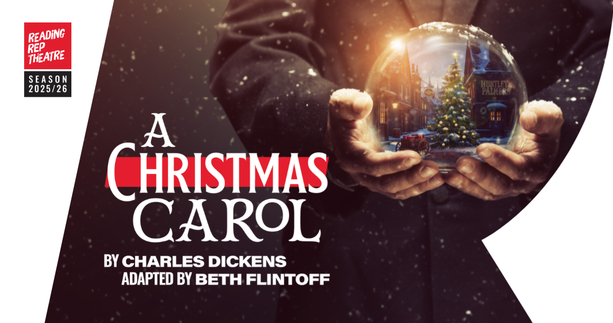 A Christmas Carol - Reading Rep. Man holding a snowglobe